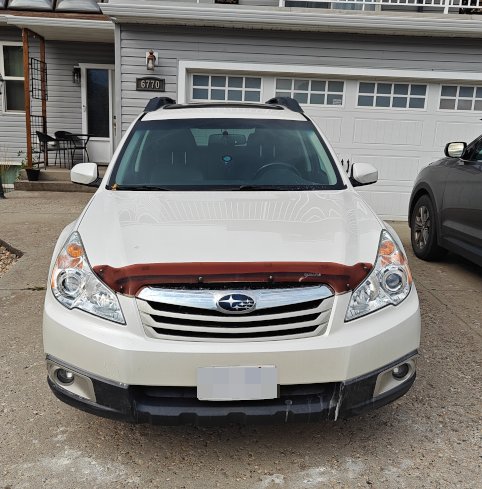 Same car front end with both headlights clear and bright