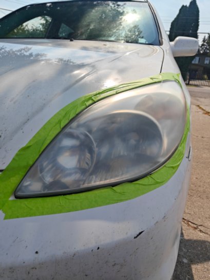 Headlight before restoration — cloudy, yellowed lens