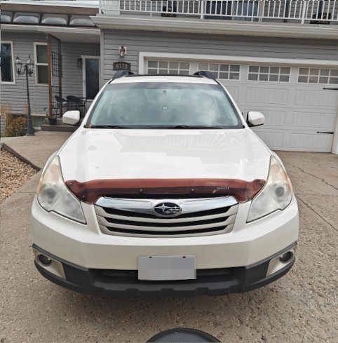 Car front end with both headlights fogged and dull