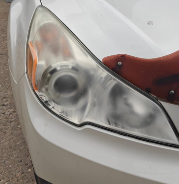 Hazy, oxidized headlight lens before restoration